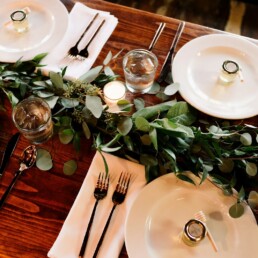 white ceramic dinner plate set on brown wooden table